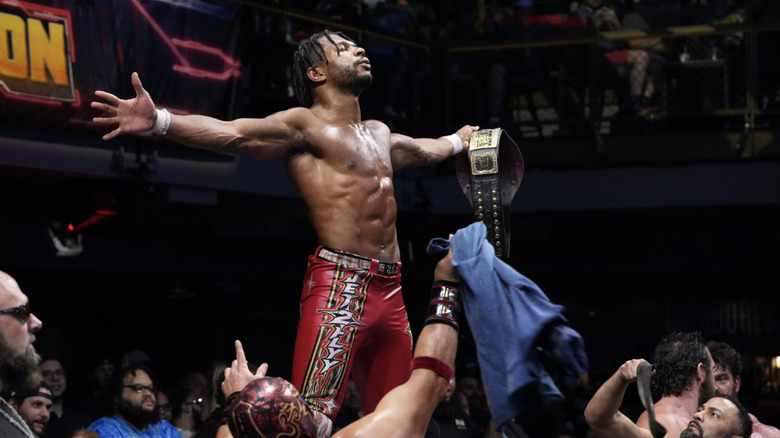 Knight holding his TNT Championship belt