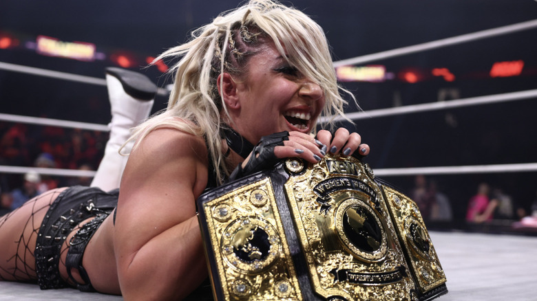 Thekla in the ring with her AEW Women's World Championship belt
