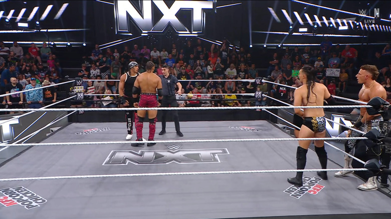 All four men inside and around the ring
