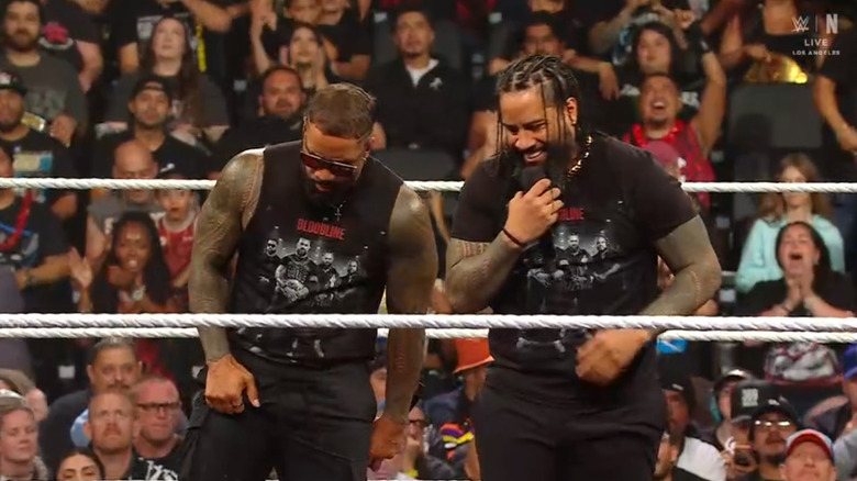 Jey and Jimmy standing inside the ring