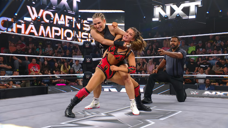 Nattie wearing down Grey with an Abdominal Stretch