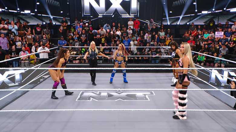 All four women staring one another down in the ring