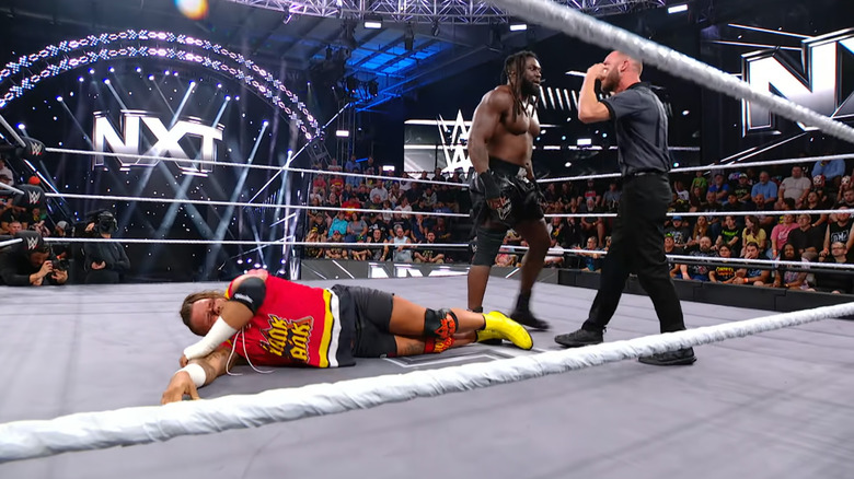 Carver in the referee's face as Ledger is still down