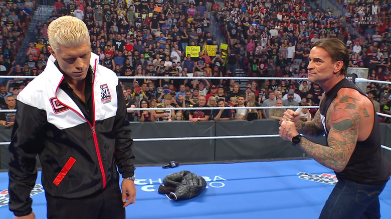 Rhodes and Punk squaring up inside the ring