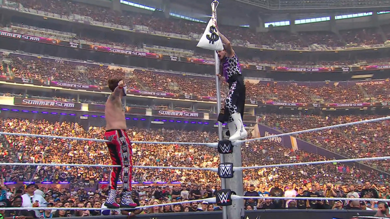 Danhausen and Dominik teetering on the ropes