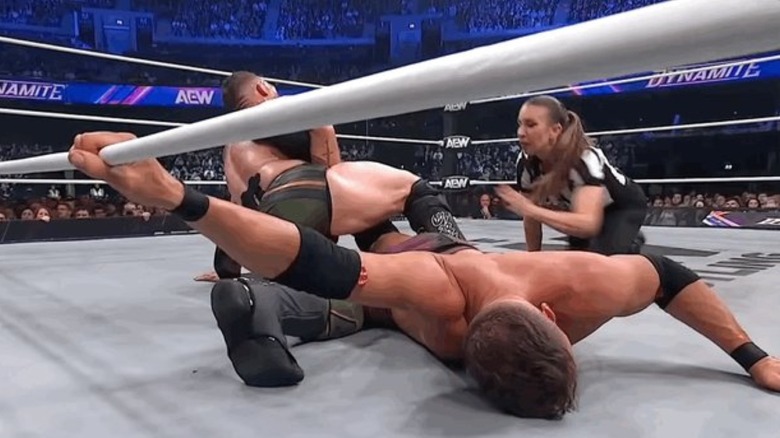 Kyle O'Reilly holds Nigel McGuinness in the ring
