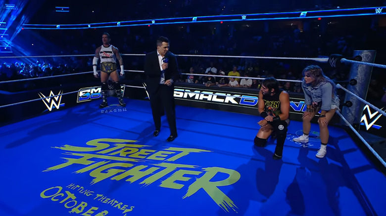 Punk, Gargano, and LeRae inside the ring during the announcement