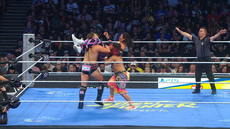 Kyoki double teaming on Wilson and Miz